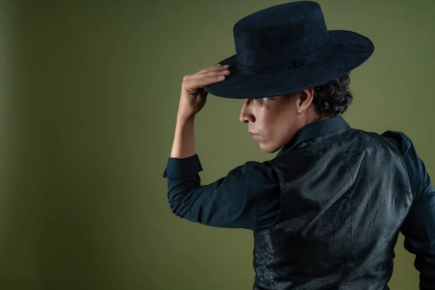 A flamenco dancer in a ruffled dress mid-movement