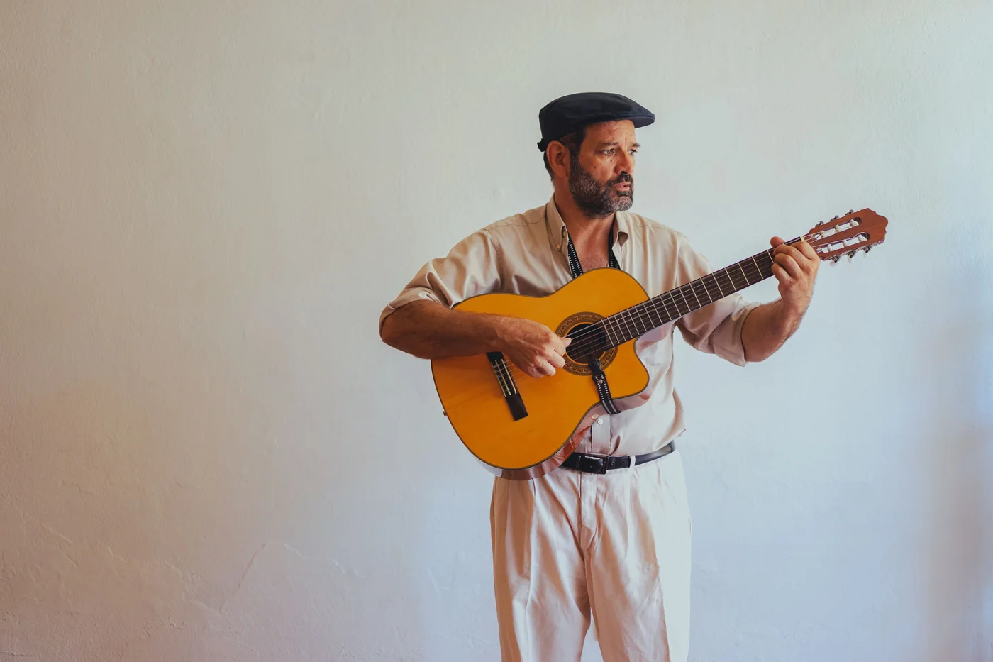 A flamenco guitarist playing on stage